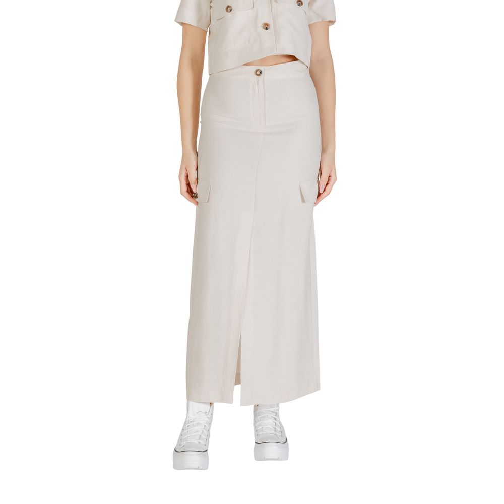 Woman wearing Jacqueline De Yong Bicolor Viscose Long Skirt with side pockets and white sneakers.