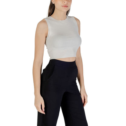 Jacqueline De Yong White Viscose Tank Tops on model, elegant cropped design, styled with black trousers for a chic summer look.