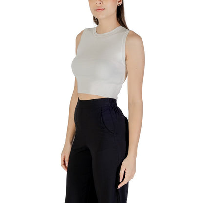 Jacqueline De Yong White Viscose Tank Tops worn by model, showcasing sleeveless cropped design with high-waisted black pants.