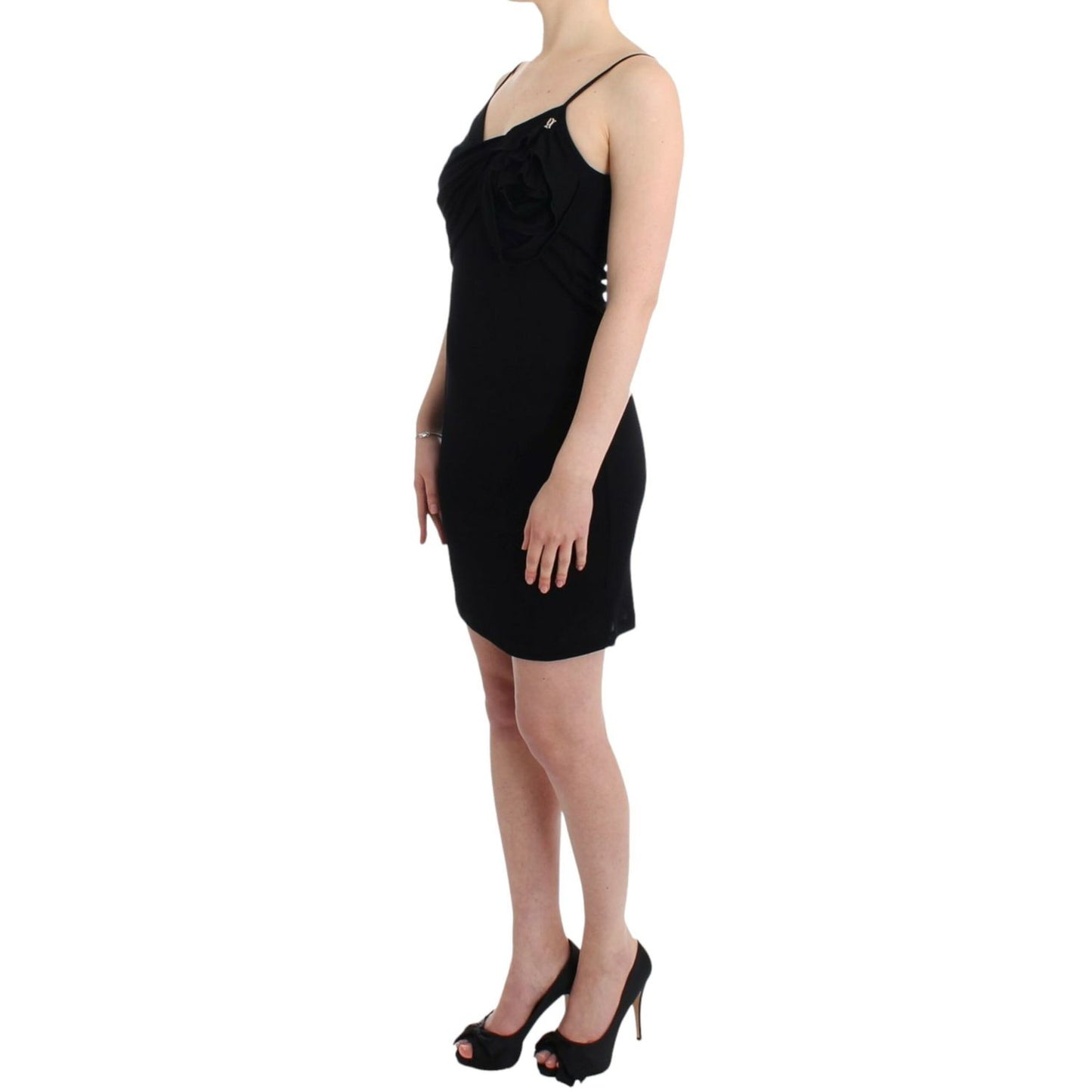 Woman wearing a John Galliano Black coctail dress with spaghetti straps and above knee length design