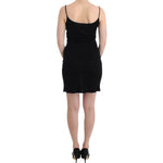 Model wearing John Galliano Black coctail dress, above knee length, spaghetti straps, back view, viscose material, elegant and stylish.