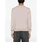 Back view of model wearing Maison Kitsuné Maison Kitsune Fox motif sweater in light beige with crew neck and ribbed cuffs.
