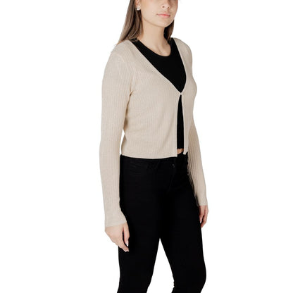 Woman wearing Morgan De Toi Gold Viscose Sleveless Jacket with black top and pants, showcasing elegant fitted design and ribbed texture.
