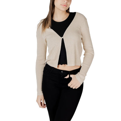 Woman wearing Morgan De Toi Gold Viscose Sleveless Jacket with cropped design and single button closure, enhancing elegance and sophistication.