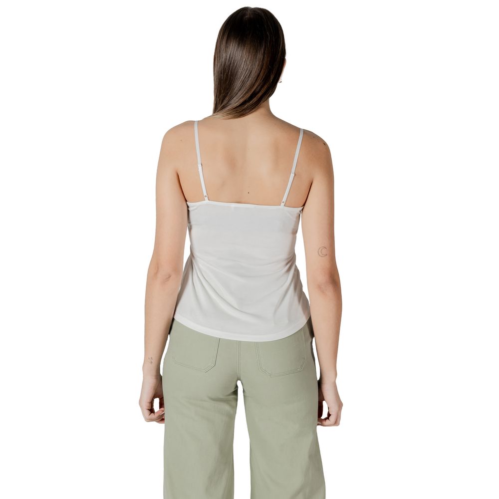 Back view of woman wearing Morgan De Toi White Modal Tank Top with lace details, perfect for summer and layering, in casual setting.