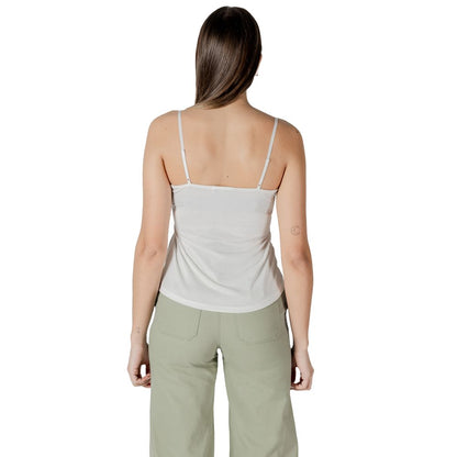 Back view of woman wearing Morgan De Toi White Modal Tank Top with lace details, perfect for summer and layering, in casual setting.