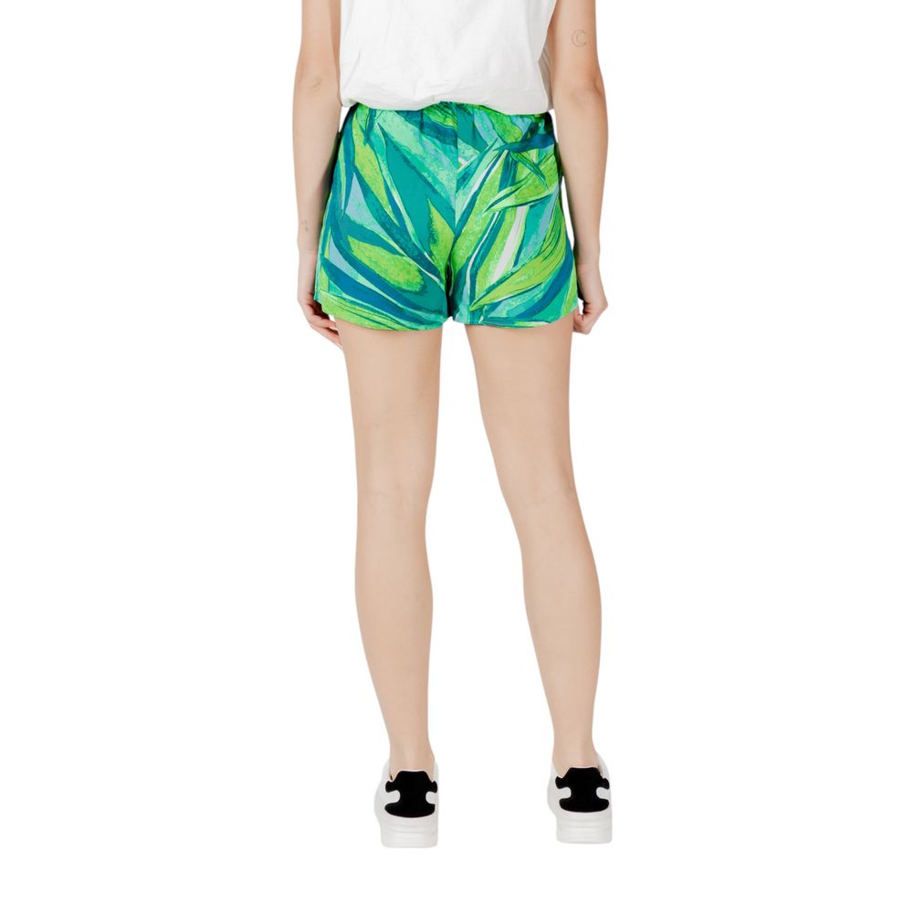 Rear view of Only Green Viscose Shorts with tropical design, worn by a woman, perfect for summer and casual outings.