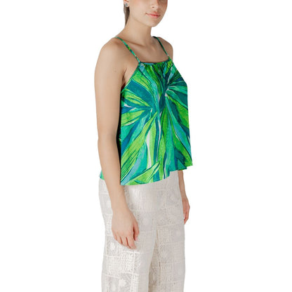 Woman wearing Only Green Viscose Tank Top with floral pattern, perfect for summer and spring fashion.