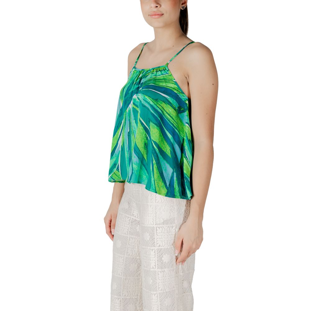 Woman wearing Only Green Viscose Tank Top with a floral pattern, showcasing a lightweight and comfortable design for summer and spring.