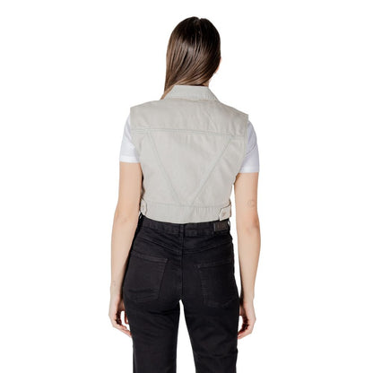 Back view of Only Light Blue Cotton Sleeveless Jacket worn over a white t-shirt, showcasing cropped fit and denim detail.