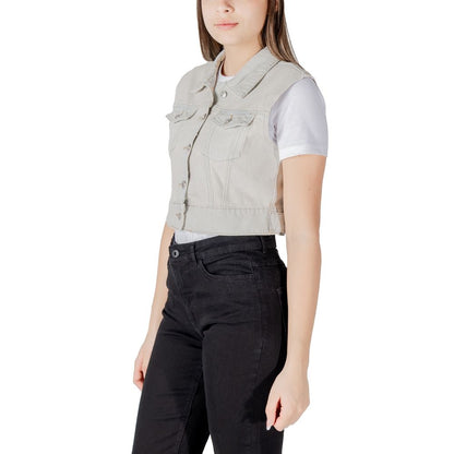 Only Light Blue Cotton Sleveless Jacket with metallic buttons and pockets styled over a t-shirt, shown in a side view.