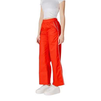 Woman wearing Only Red Cotton Casual Pants with elastic waistband and piping detail, perfect for a stylish spring or summer look.