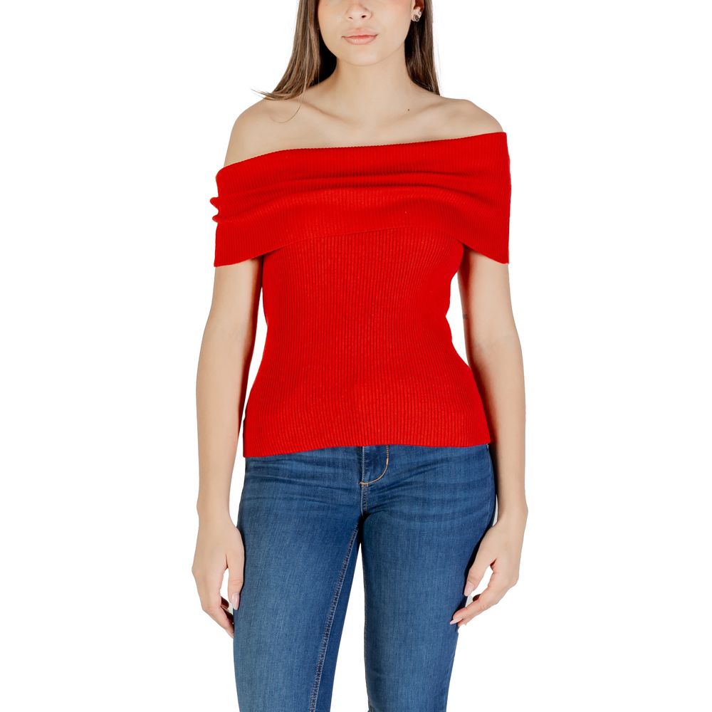 Woman wearing Only Red Polyester T-Shirt, off-shoulder design, paired with blue jeans, showcasing stylish and sustainable fashion.