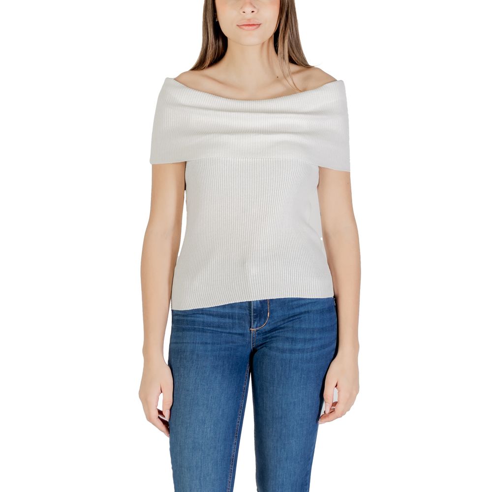 Woman wearing Only White Polyester T-Shirt with off-shoulder design, paired with jeans for a stylish and sustainable look.