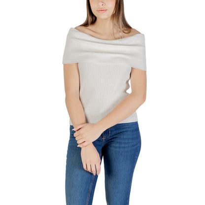 Woman wearing Only White Polyester T-Shirt, off-shoulder design, paired with jeans, highlighting sustainable fashion and style.