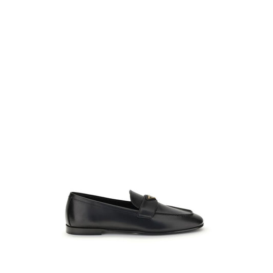 Prada Leather Loafers with squared toe and logoed plaque, flat sole, made from calf leather, AW25 collection, Made in Italy.