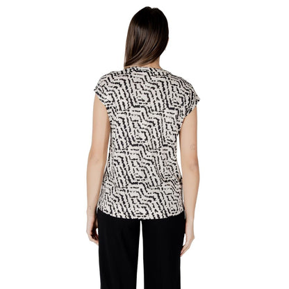 Back view of Street One Cream Cotton T-Shirt with unique print, perfect for a casual-chic look, paired with black trousers.