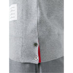 Close-up of Thom Browne Sweaters Grey 4-Bar cotton sweatshirt side button detail and name tag applique.