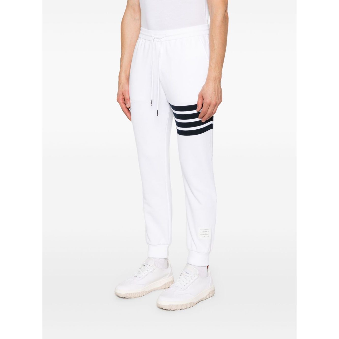 Thom Browne Trousers White with elasticated waistband, side pockets, logo patch, grosgrain loop tab, 4Bar design, cotton sweatpants.