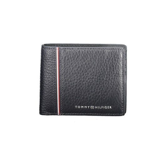 Tommy Hilfiger Blue Leather Men WalletExperience the perfect blend of sophistication and practicality with the Tommy Hilfiger leather wallet. Crafted with the contemporary man in mind, this wallet boasts dual card slots designed to accommodate your essent