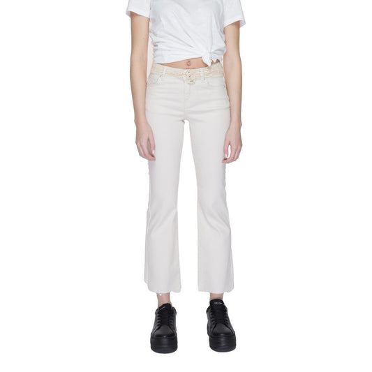 Woman wearing Vero Moda Beige Cotton Bootcut Jeans, featuring a flared design and soft, stretchy fit for a flattering silhouette.