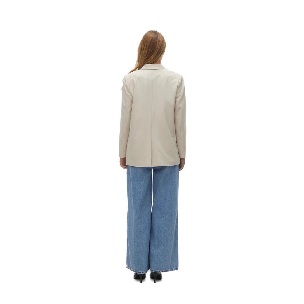 Back view of woman wearing Vero Moda Beige Polyester Blazer with wide-leg jeans.