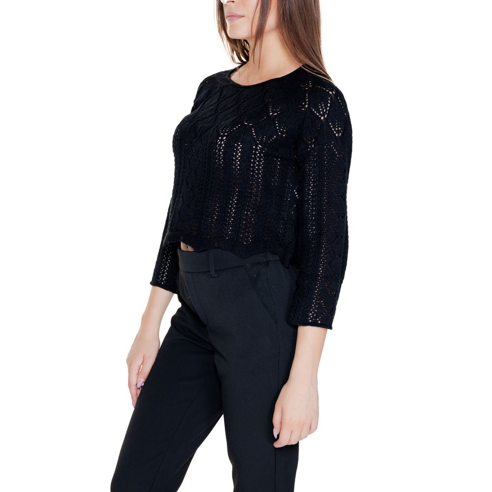 Model wearing Vero Moda Black Cotton Sweatshirt with openwork design and cropped cut, showcasing casual elegance.