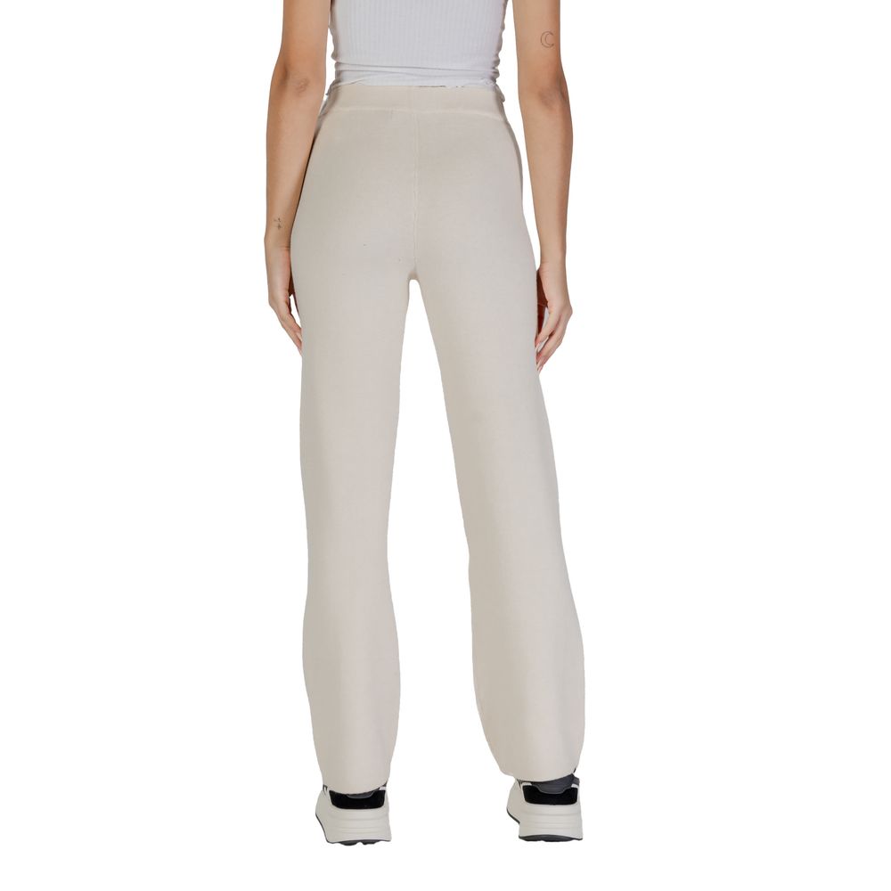 Back view of Vero Moda Cream Viscose Casual Pants on model, showcasing wide-leg palazzo style for elegance and comfort.