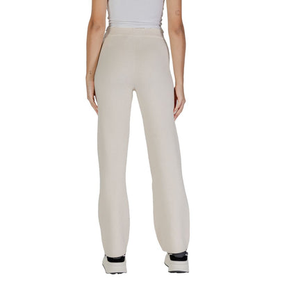 Back view of Vero Moda Cream Viscose Casual Pants on model, showcasing wide-leg palazzo style for elegance and comfort.