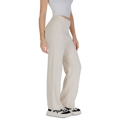Model wearing Vero Moda Cream Viscose Casual Pants with wide-leg design for elegant and comfortable style.