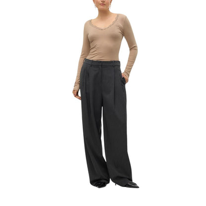 Woman wearing Vero Moda Gray Polyester Casual Pants with pinstripe pattern and wide-leg design.