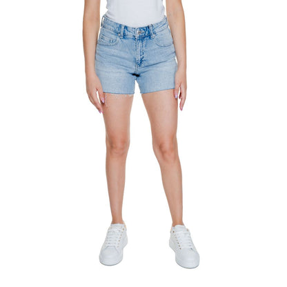 Model wearing Vero Moda Light Blue Cotton Shorts with a simple design and comfortable fit, featuring front and back pockets.