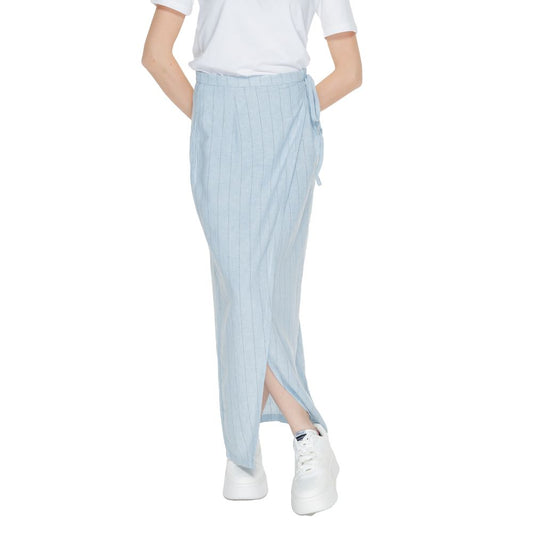 Woman wearing Vero Moda Light Blue Linen Long Skirt with vertical pinstripes and side tie.