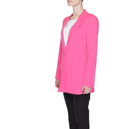 Woman wearing Vero Moda Pink Polyester Blazer with a tailored fit, single button, and classic lapel, showcasing modern elegance.