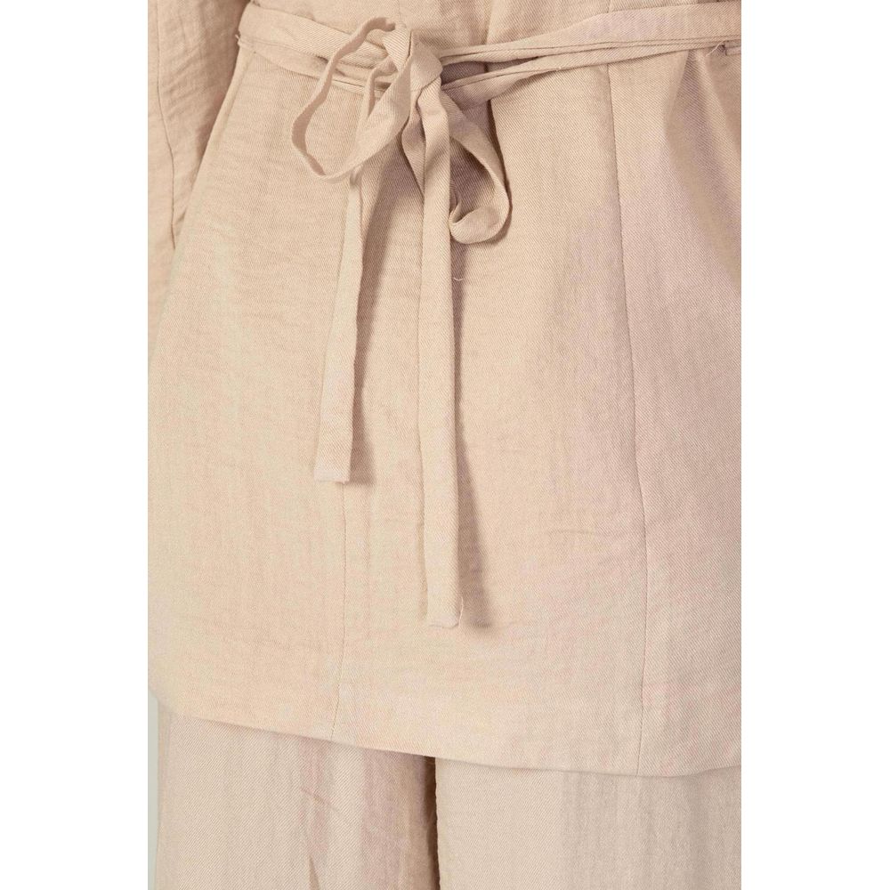 Close-up of Vero Moda Pink Viscose Blazer showing fabric texture and belt detail.
