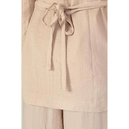 Close-up of Vero Moda Pink Viscose Blazer showing fabric texture and belt detail.