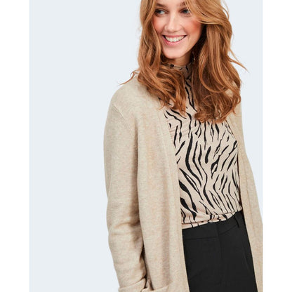 Woman wearing Vila Clothes Beige Viscose Cardigan with zebra print top.