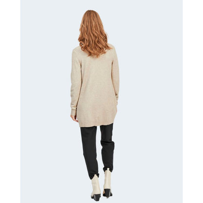 Back view of woman wearing Vila Clothes Beige Viscose Cardigan, showcasing its chic and versatile design with comfortable knit fabric.