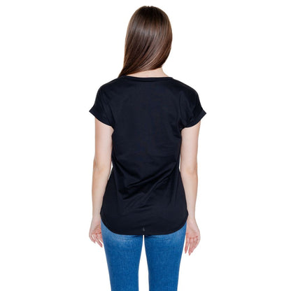 Back view of woman wearing Vila Clothes Black Cotton T-Shirt with rolled-up sleeves and round neckline, showcasing casual style and comfort.