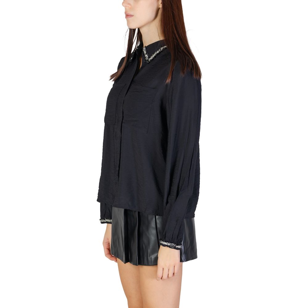 Woman wearing Vila Clothes Black Viscose Blouse with braided trim collar, highlighting modern design and comfort.