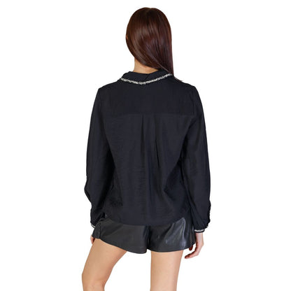 Back view of Vila Clothes Black Viscose Blouse with braided collar trim and elasticated cuffs, worn by a model in black shorts.