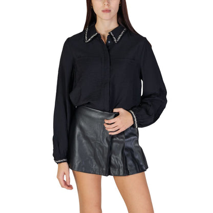 Woman wearing Vila Clothes Black Viscose Blouse with braided collar and elasticated cuffs, styled elegantly with black leather skirt.