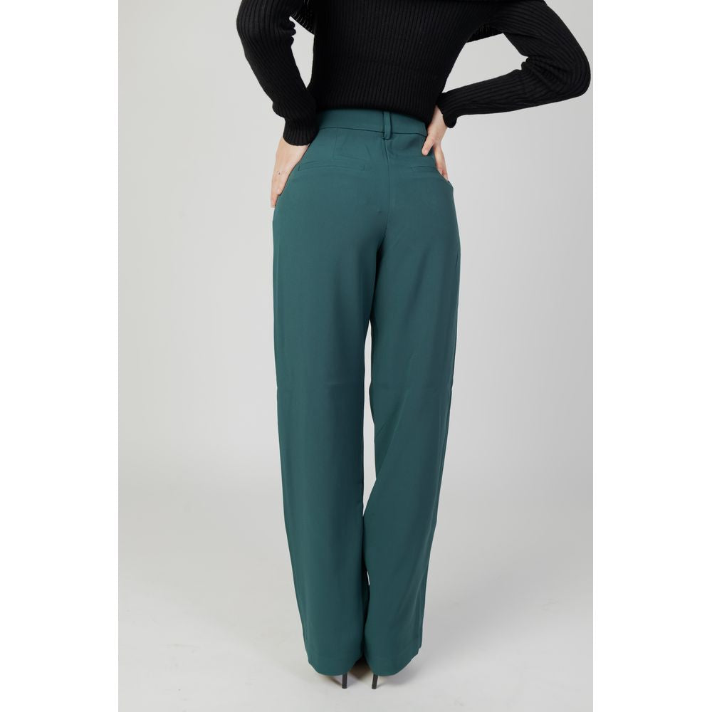 Woman wearing Vila Clothes Green Recycled Polyester Flared Pants.