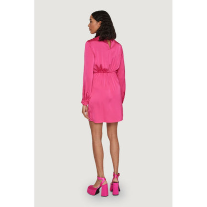 Model wearing Vila Clothes Pink Polyester Short Dress with long sleeves and waist knot detail, viewed from the back.